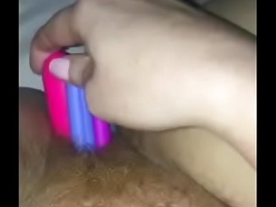 Stretched out with pens, vibrators, dildos and dog toys